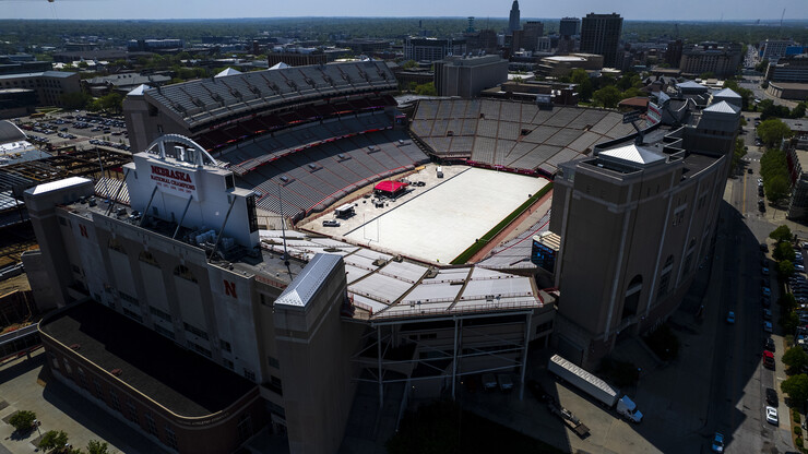 Aerial view of Memorial Stadium with field covered for commencement