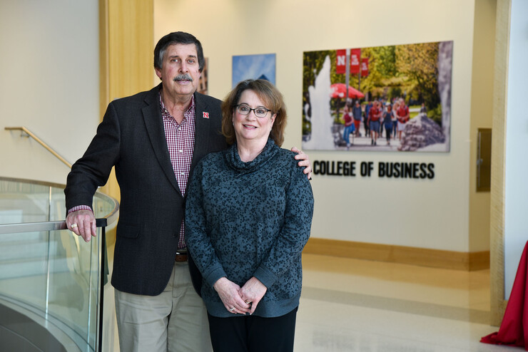 Paul and Mary Ann Koehler pose near a staircase in Howard L. Hawks Hall.