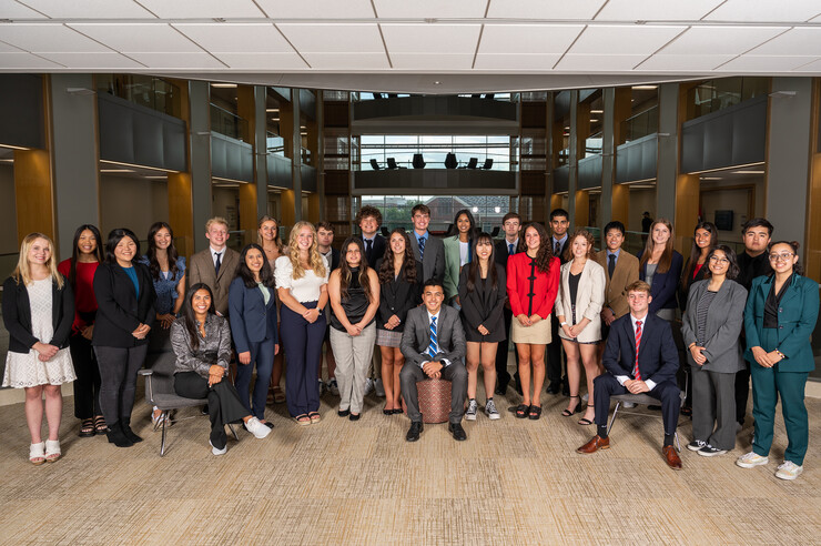 Twenty-eight members of the second cohort of Inclusive Business Leaders pose for a photograph in Hawks Hall.