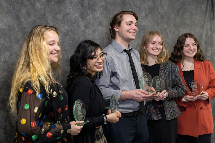 The finalists for the 2023 Perry Photojournalism Challenge pose with their awards. They are (from left) Meredith Gamet, first place; Amber Rodriguez, third place; Hayden Rooney, honorable mention; Jordan Moore, second place; and Lydia Hernandez, honorable mention.