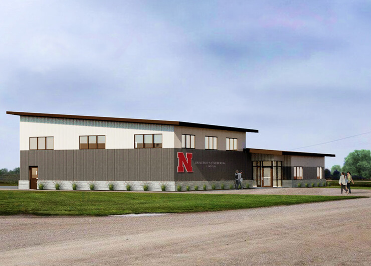 A rendering of the NFarms building, featuring a sloped roof, and the Nebraska N and "University of Nebraska–Lincoln" on the front.