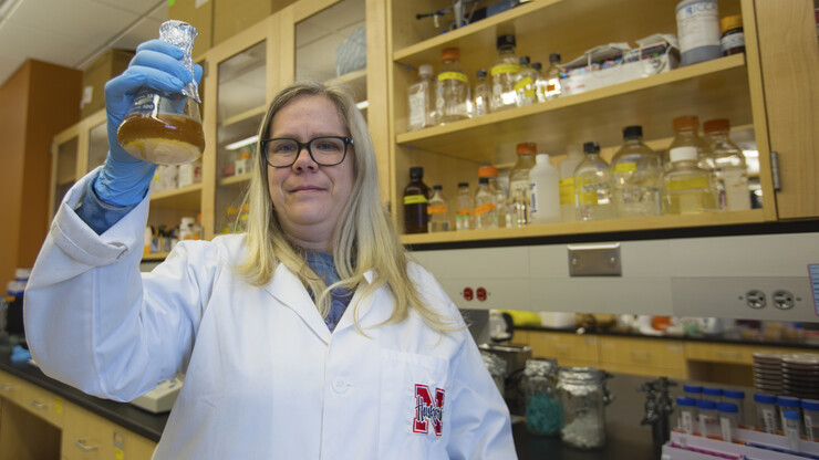 Nebraska's Heather Hallen-Adams holds a beaker of the yeast she helped identify for Lincoln's Boiler Brewing Company. The yeast was used to brew Nebraska Native, an American wild ale and the first commercially available craft beer made only from Nebraska ingredients.