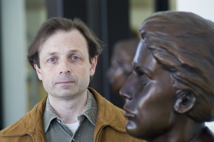 John Sorensen stands next to the bust of Grace Abbott in the entryway of Grand Island's Edith Abbott Memorial Library. Sorensen will discuss the legacy of the Abbott sisters in the March 28 Nebraska Lecture.