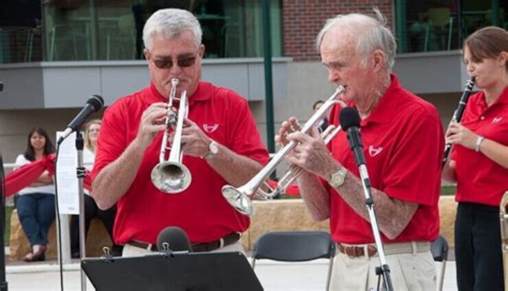 John (from left) and his father, Bill Scott, are both members of the Polonairs, a polka band based out of Omaha. Bill Scott, a long-time supporter of the university, died Feb. 27. He was 93.