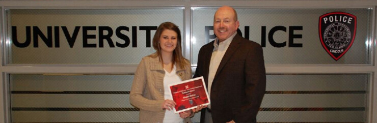 Chief Owen Yardley (right) stands with Megan Dolton, who received a Teamwork award from UNLPD.
