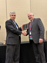 Dr. Gary Hein pictured with Clark Poppert, NAICC 2023 President