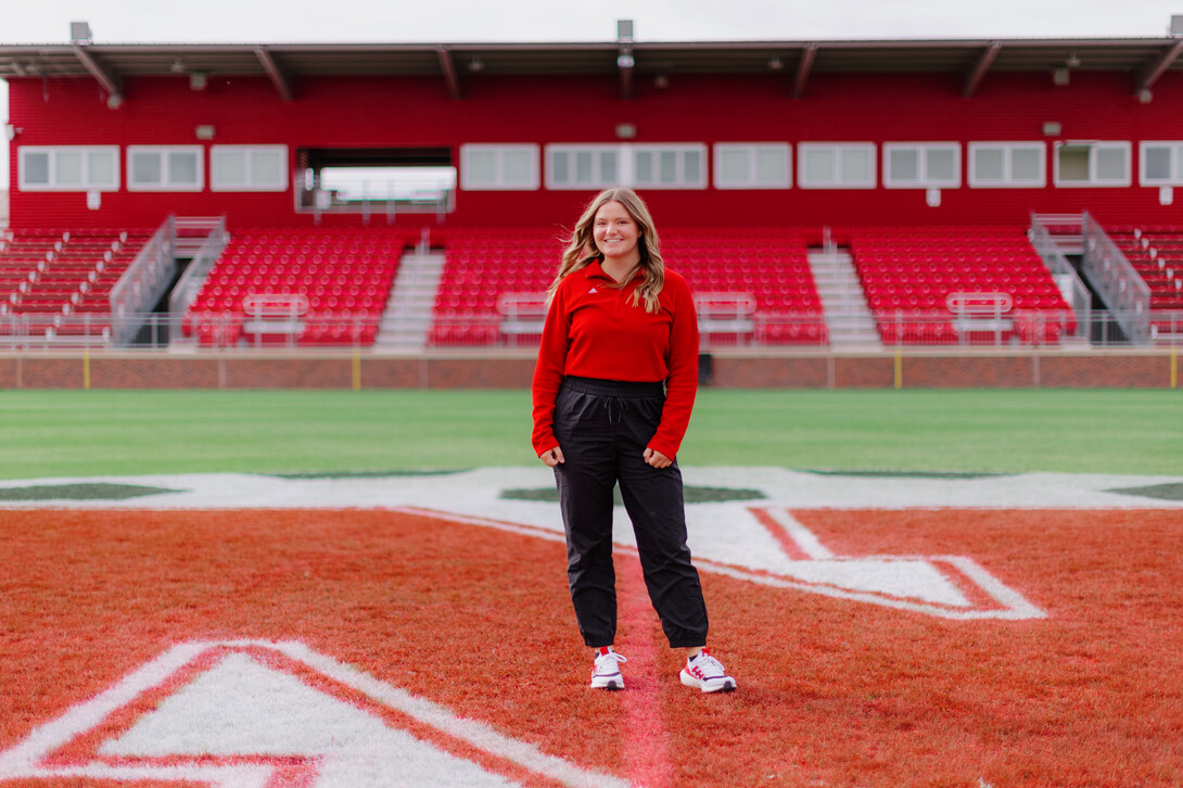 Regan Vaccaro smiles for a photo on the Hibner Stadium field.