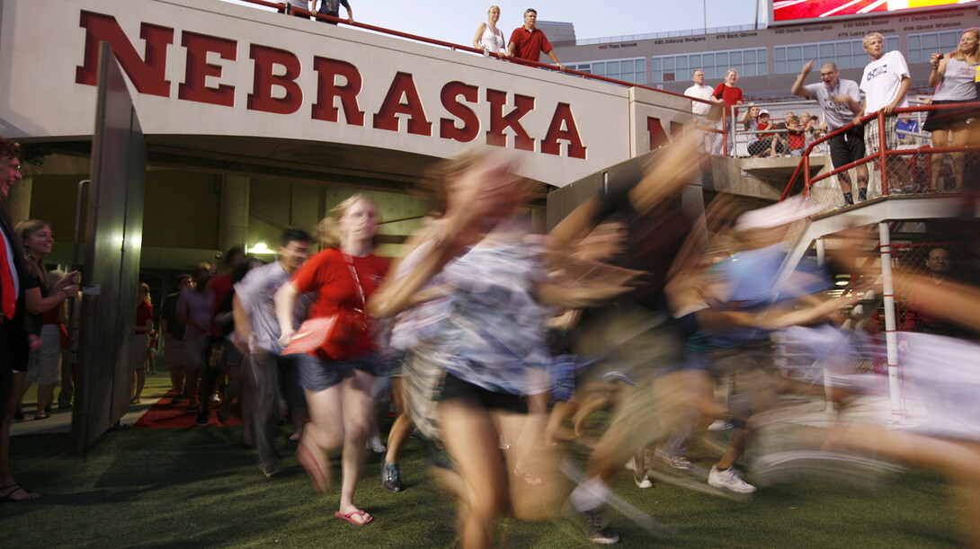 Students flood into Memorial Stadium during a UNL's annual Big Red Welcome event. This year, UNL will launch the First Husker program to offer support to first-generation college students.