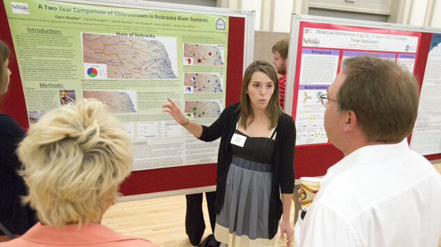 A student showcases her research project during the 2012 Nebraska Summer Research Symposium. The 2014 event is Aug. 6 in the Nebraska Union.