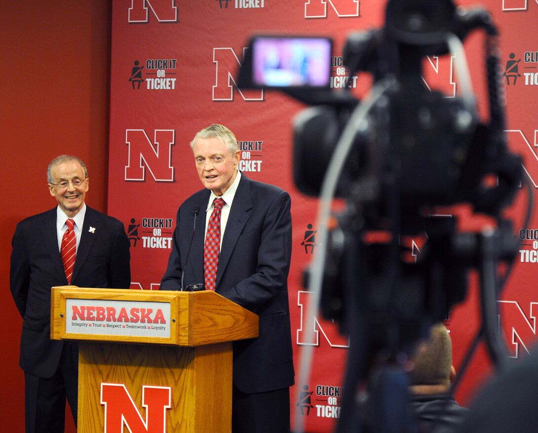 Chancellor Harvey Perlman and Activities Director Tom Osborne share a laugh during the Sept. 26 announcement at Memorial Stadium.