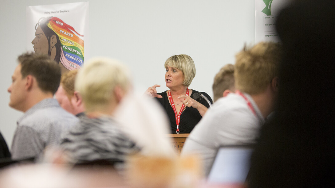 Nebraska's Susan Swearer, professor of educational psychology, talks about empowerment with leaders from Paul Mitchell Schools. Swearer is a national expert on bullying.