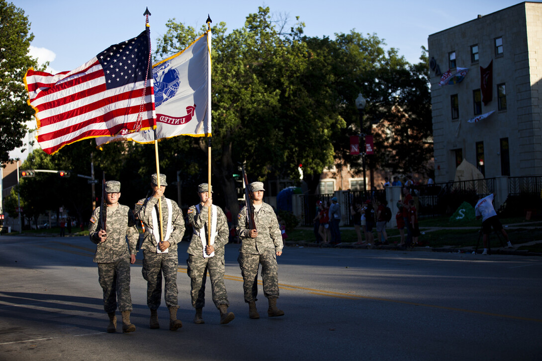 The opening of the 2013 UNL homecoming parade was led by the Army ROTC color guard.