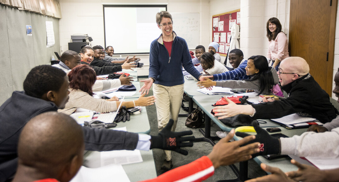 Elizabeth Theiss-Morse greets a group of students from Africa before lecturing on "Why National Identity Matters in American Politics" during the 2014 Study of the United States Institute on Civic Engagement. At right is Patrice McMahon, academic director of the SUSI Institute and associate professor of political science. UNL has received a federal grant to host the program again in 2015.