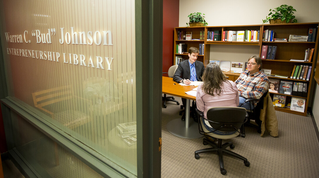 Nebraska law student Daniel Sweeney (left) meets with Lisa and Cameron Lauver of Pierce as part of the College of Law’s Entrepreneurship Legal Clinic.