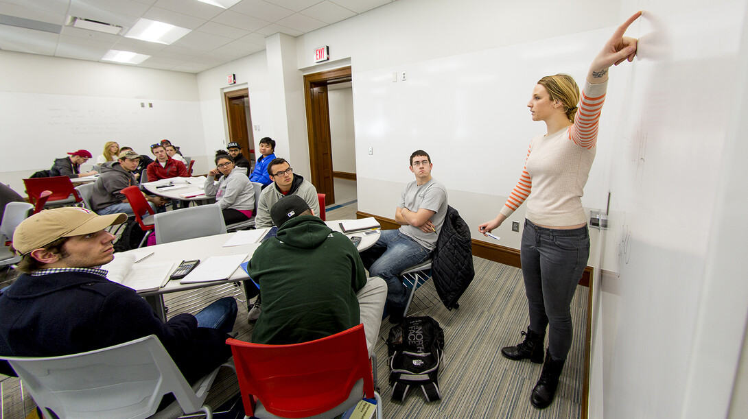 Graduate student Laura Ismet leads a mathematics lecture inside a renovated Brace Hall classroom.