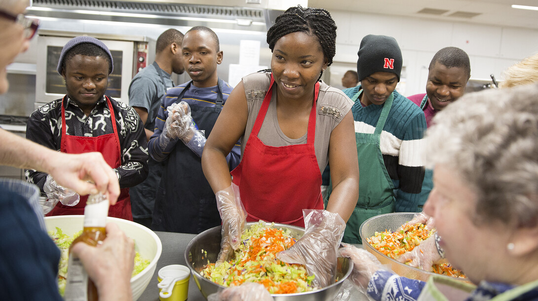 SUSI volunteers prepare to serve lunch at the Matt Talbot Kitchen on Jan. 27. Students in the U.S. Department program on democracy and civic engagement are attending classes at UNL and learning about the region. The students are from Angola, Botswana, Mozambique, South Africa and Zimbabwe.