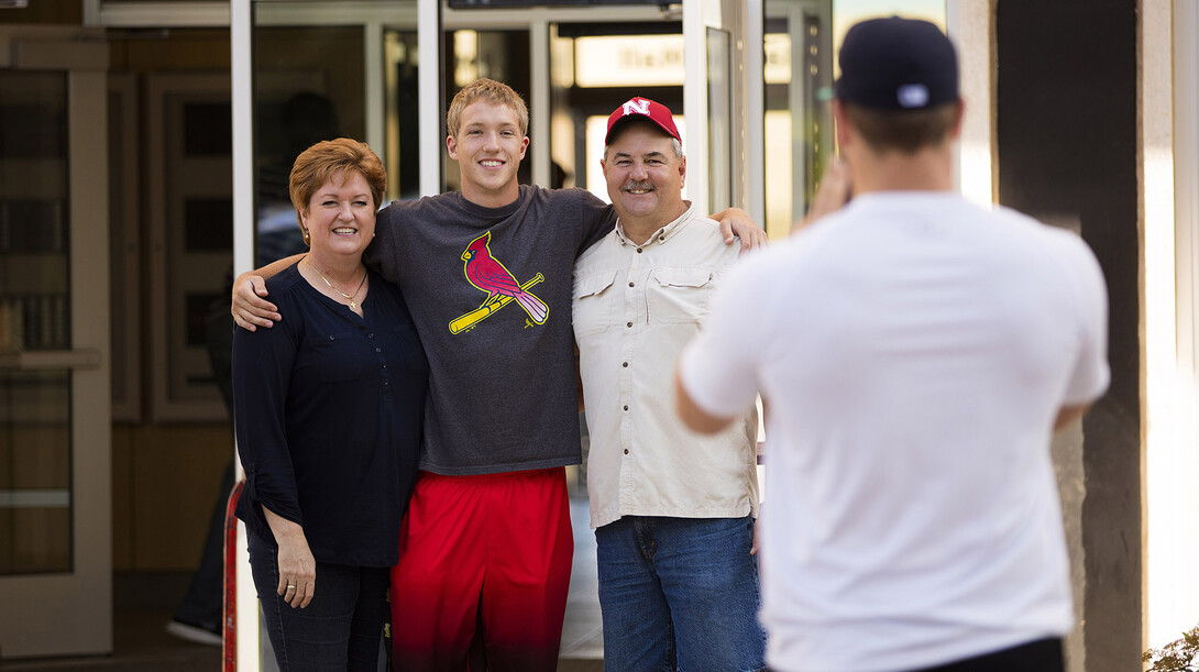 Luke Siedhoff hugs his mom, Judy, and dad, Bob, for a photo taken by his older brother, Matt. The Crete, Nebraska, family moved Luke and Matt to UNL on Aug. 20.