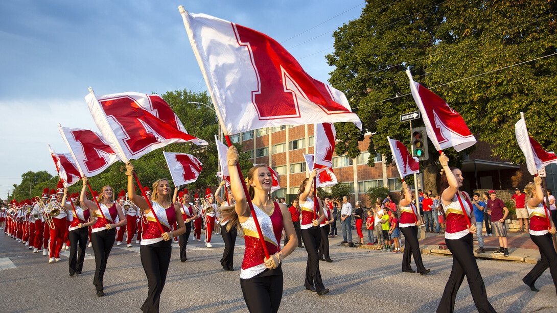 Flag corps members participate in the 2015 Nebraska homecoming parade. The annual parade is Sept. 30.