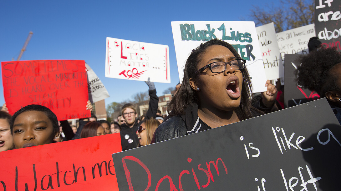 Students react during the Nov. 19 "Black Lives Matter" rally at UNL. The event featured student speakers talking about their experiences at UNL.