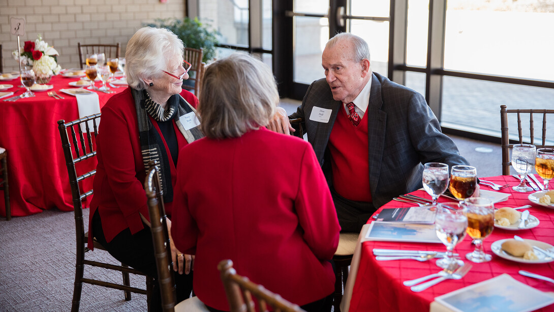 Nancy Busch (from left), dean of the University Libraries, and Virginia Nelson speak to Don Hall Sr., after the March 28 dedication ceremony. Don and Adele Coryell Hall were married for nearly 60 years.