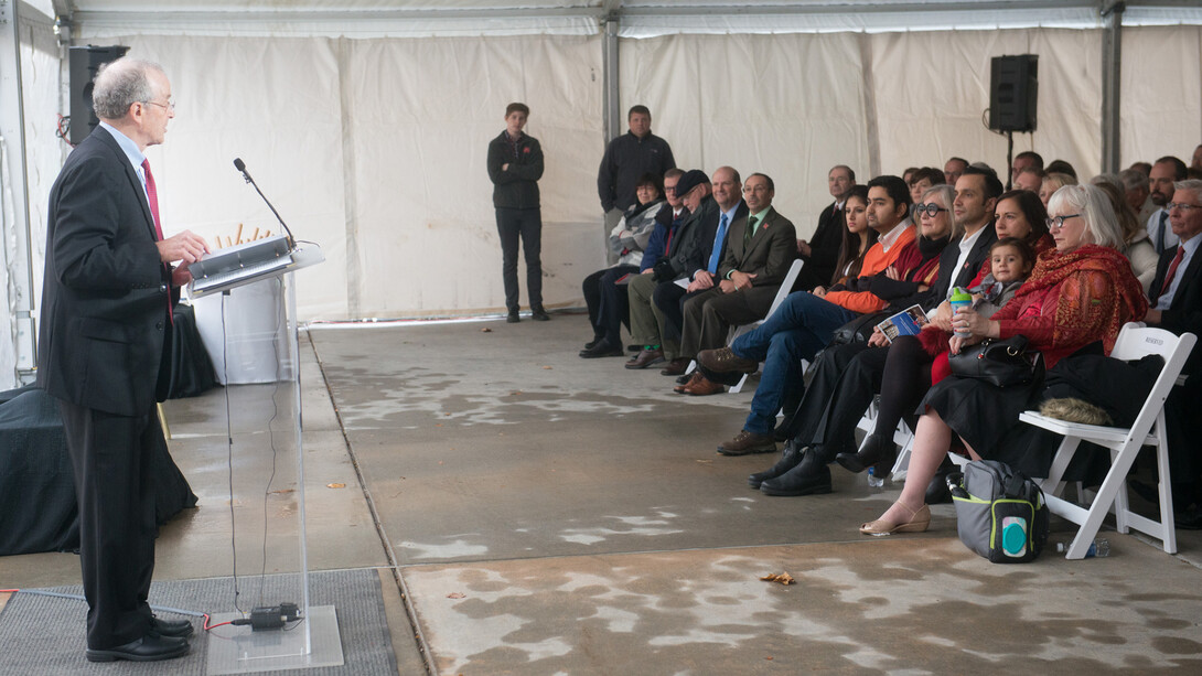Harvey Perlman talks about Prem Paul during the Nov. 22 ceremony, which was held in a tent outside the recently renamed Prem S. Paul Research Center at Whittier School.