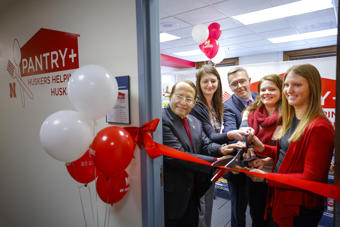 Vice Chancellor for Student Affairs Juan Franco, left, with Chancellor Ronnie Green and others at Jan. 9's grand opening of the Huskers Helping Huskers Pantry+ grand opening. 