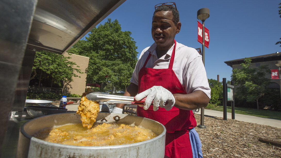 .Ron White cooks catfish during an East Union Café and Grill summer grill out on June 16. Housing has offered the lunch hour specials for five years.