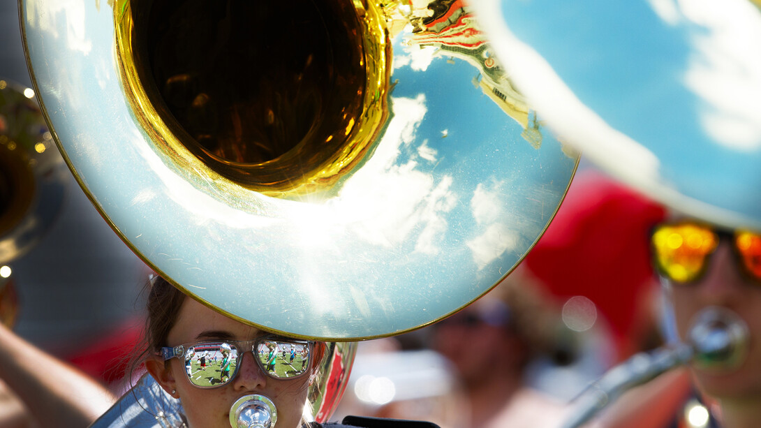 A sousaphone play practices with the Cornhusker Marching Band in Memorial Stadium.