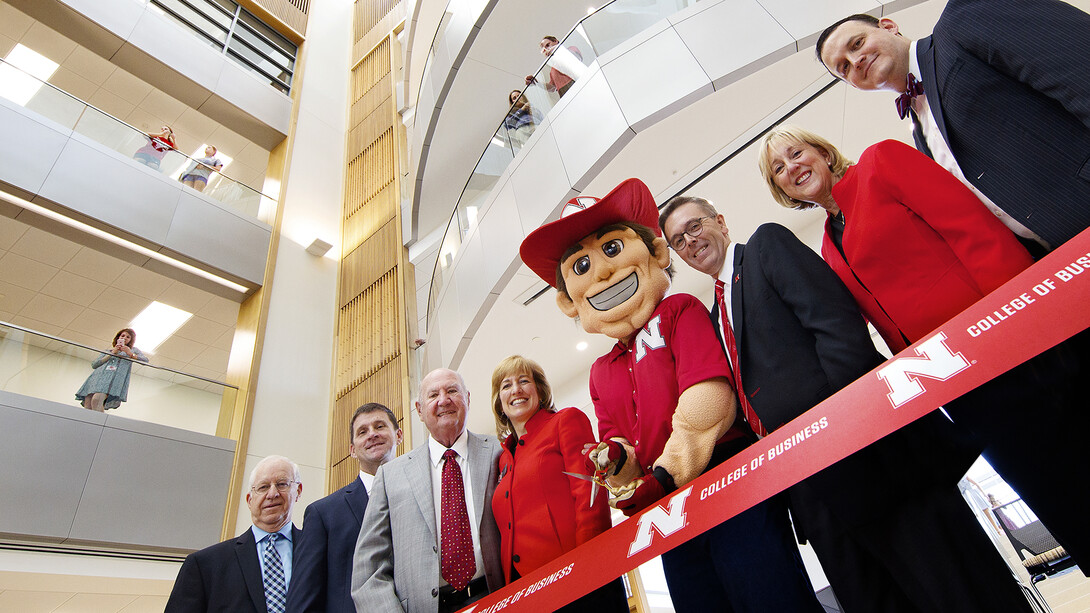 University dignitaries, including Howard L. Hawks (third from left) pose for a ribbon cutting photo in Howard L. Hawks Hall, the home to the University of Nebraska–Lincoln's College of Business, on August 18, 2017.