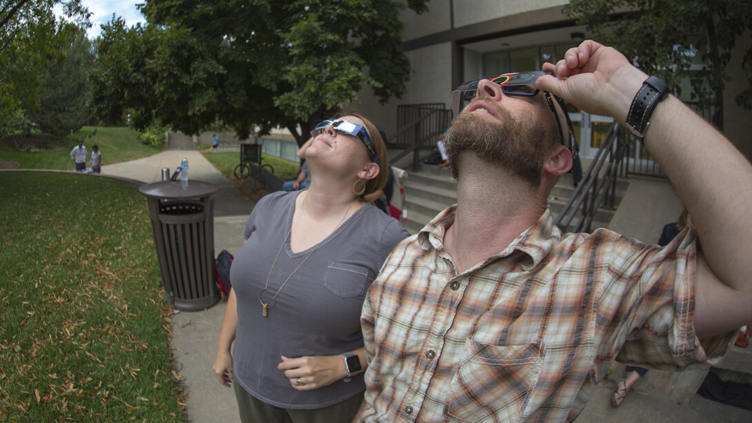 Melanie and Michael Reinmiller watch the eclipse after totality.