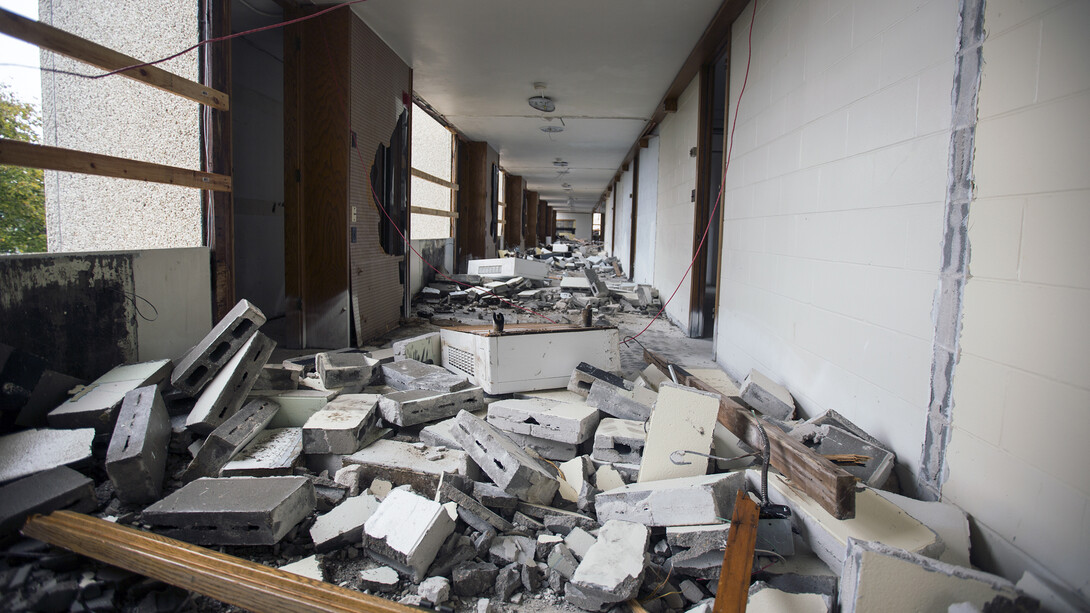 Walls between rooms on the fourth floor of Cather Hall have been turned to rubble as part of implosion prep.