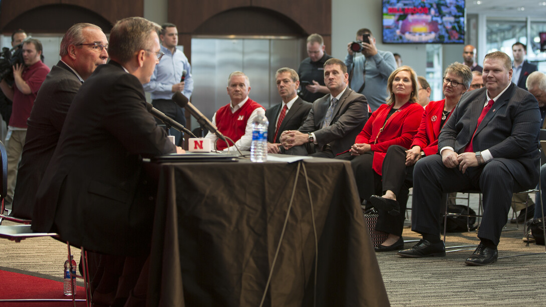 Chancellor Ronnie Green thanks Dave Rimington (right, seated) for serving as Nebraska's interim director of athletics, during the Oct. 15 announcement that Bill Moos has been hired to lead the Huskers.