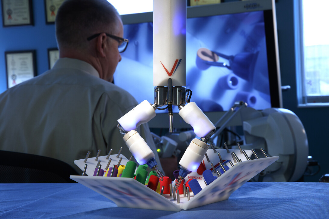 Shane Farritor operates the Virtual Incision surgical robot in the group's previous space at Nebraska Innovation Center.