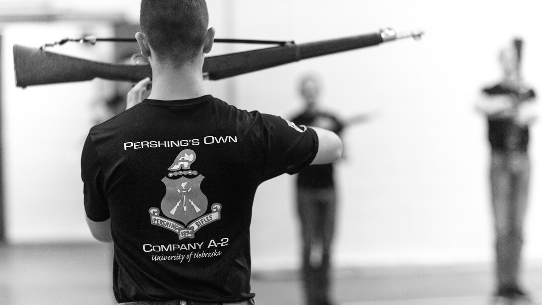 Air Force Cadet 3rd Class Zachary Day leads the group in warmups. Pershing Rifle drill team practices in the Pershing Military and Naval Science Building.  Student organization sponsored by ROTC.  April 17, 2019. Photo by Craig Chandler / University Communication