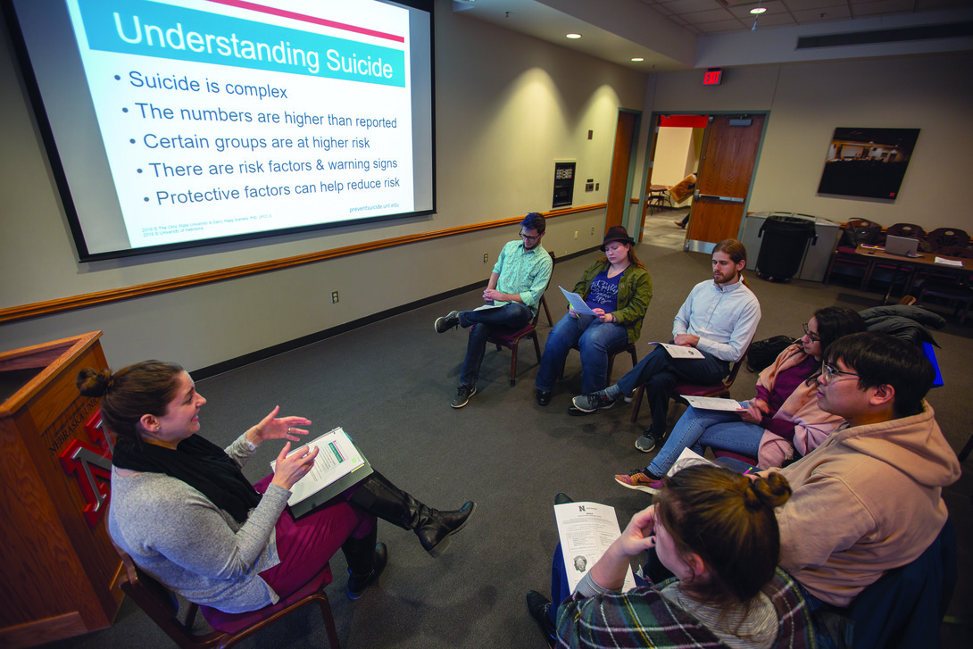 Laura Shell (left) leads a REACH training session with members of the Graduate Student Assembly on Jan. 29. The training system was developed by Ohio State University and is going to be the basis of Nebraska's new suicide prevention program.
