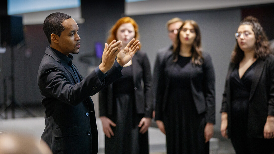 Marques Garrett, assistant professor of music, directs the UNL Chamber Singers during an MLK Week brunch performance.