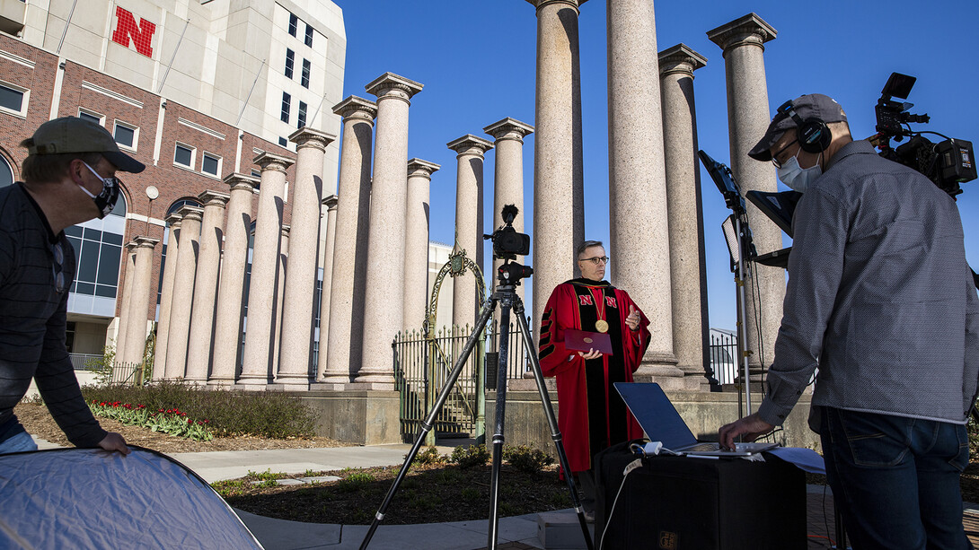 Curt Bright (from left), Chancellor Ronnie Green and David Fitzgibbon ready for a video shoot in front of the Columns in April 2020. The video was used as part of the university's remote commencement exercises for the spring 2020 semester.