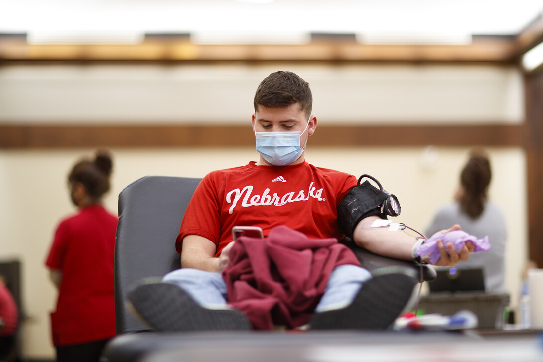 A student gives blood during the Homecoming Blood Drive in the Nebraska Union ballroom Oct. 27, 2020. The annual 2021 drive is scheduled for Sept. 27-30.