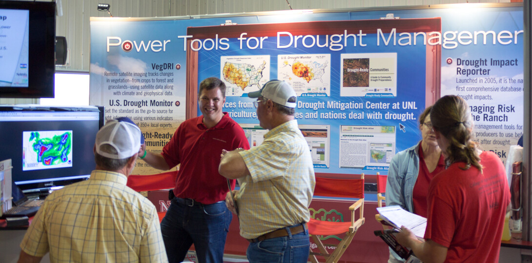 Brian Fuchs, a National Drought Mitigation Center climatologist and U.S. Drought Monitor author, discusses the prospects for rain with visitors to Husker Harvest Days, an agriculture trade show held each September in Grand Island.