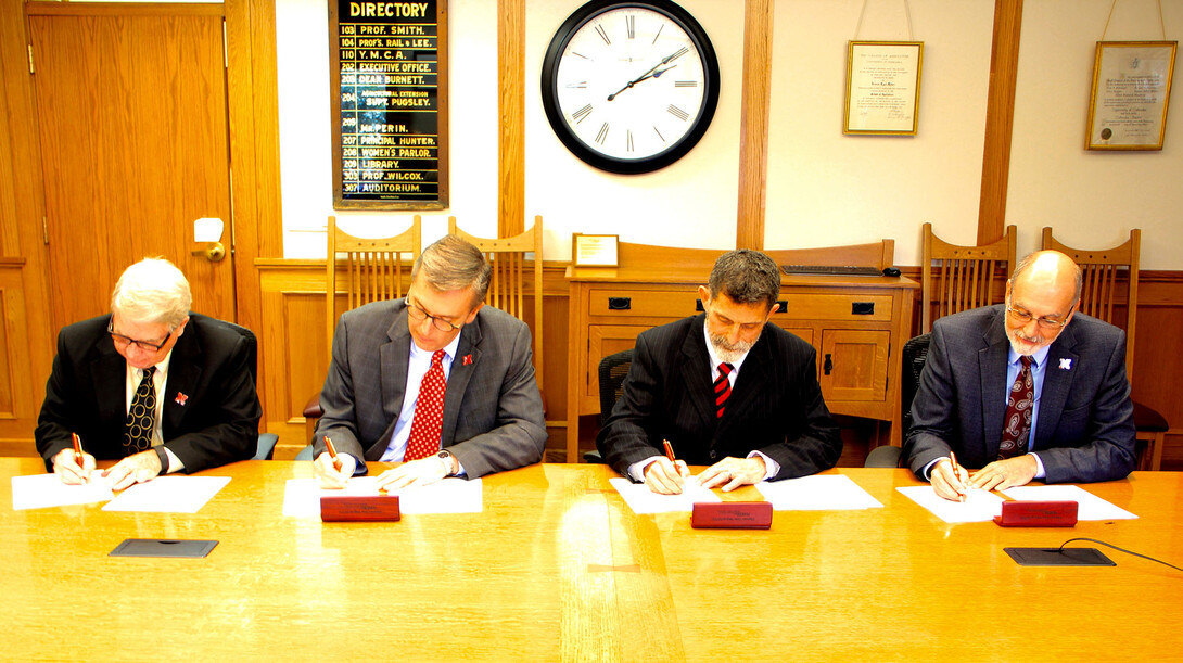 (From left) CASNR Dean Steven Waller, IANR Harlan Vice Chancellor Ronnie Green, NCTA Dean Ron Rosati and IANR Associate Vice Chancellor Ron Yoder sign a 2+2 agreement between the College of Agricultural Sciences and Natural Resources at UNL and Nebraska College of Technical Agriculture in Curtis.