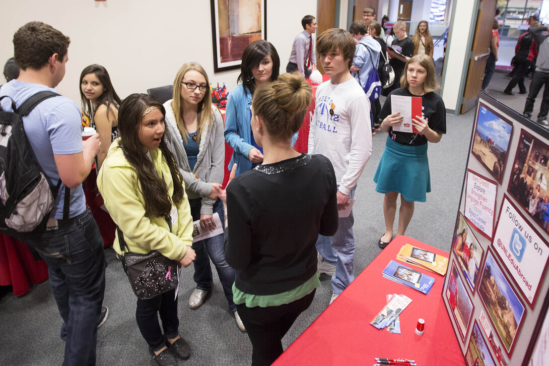 High school students listen to a presentation at the study abroad booth during the 2014 Modern Language Fair. The 2016 Modern Language Fair will be April 14 at the Nebraska Union.