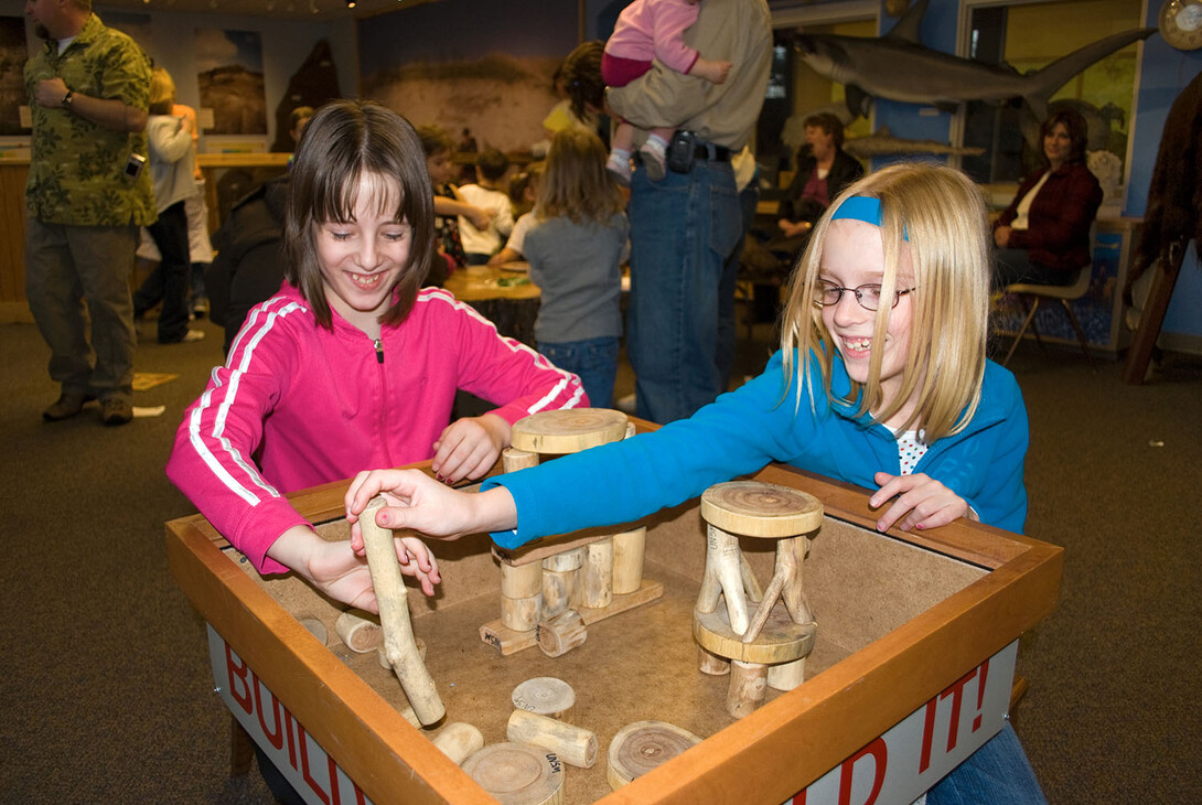 Young visitors explore science through hands-on activities in the Dr. Paul and Betty Marx Science Discovery Center in Morrill Hall. The museum will offer free admission from 4:30 to 8 p.m. each Thursday in July.