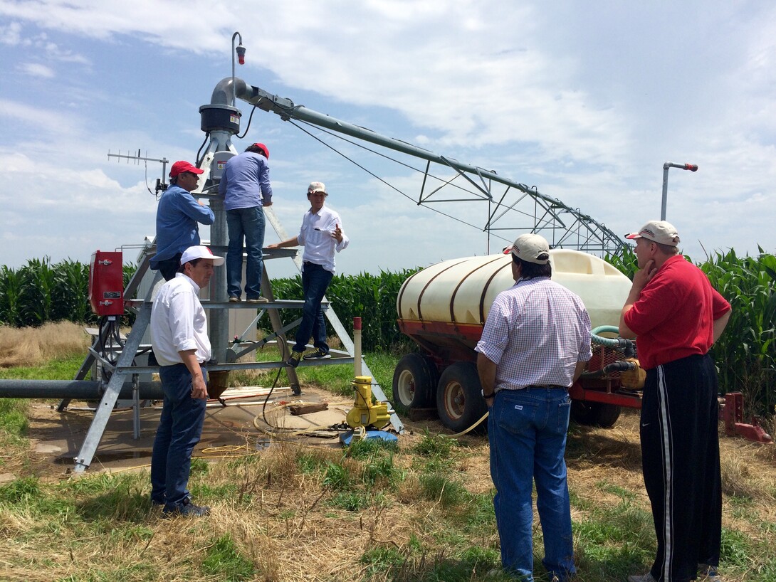 Argentine delegates discuss center pivot technology with Andy Suyker, associate professor in UNL's School of Natural Resources, during a visit to the Agricultural Research and Development Center near Mead on July 11.