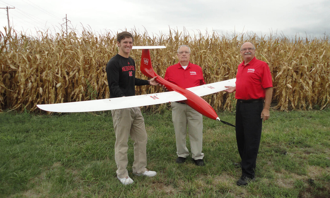 (From left) Matt Headrick, George Meyer and Wayne Woldt conduct a preflight check on an unmanned aircraft system.