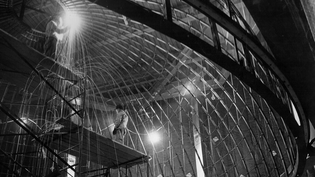 Construction workers weld metal support beams into place for the Mueller Planetarium dome in 1957. The planetarium will celebrate its 60th anniversary with a classic fulldome festival on March 24.