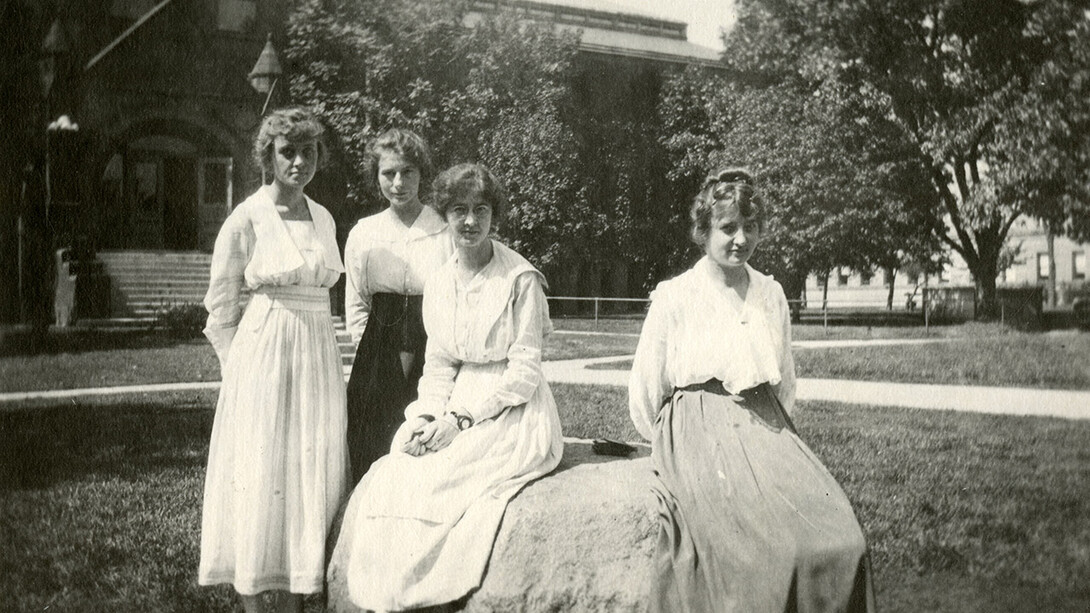 A group of women poses in front of the University of Nebraska–Lincoln library (now Architecture Hall) circa 1915. “What We Wore: Dressing Well at UNL,” featuring select garments from the 1870s through 1950s, is on view through May 10 at the Robert Hillestad Textiles Gallery.