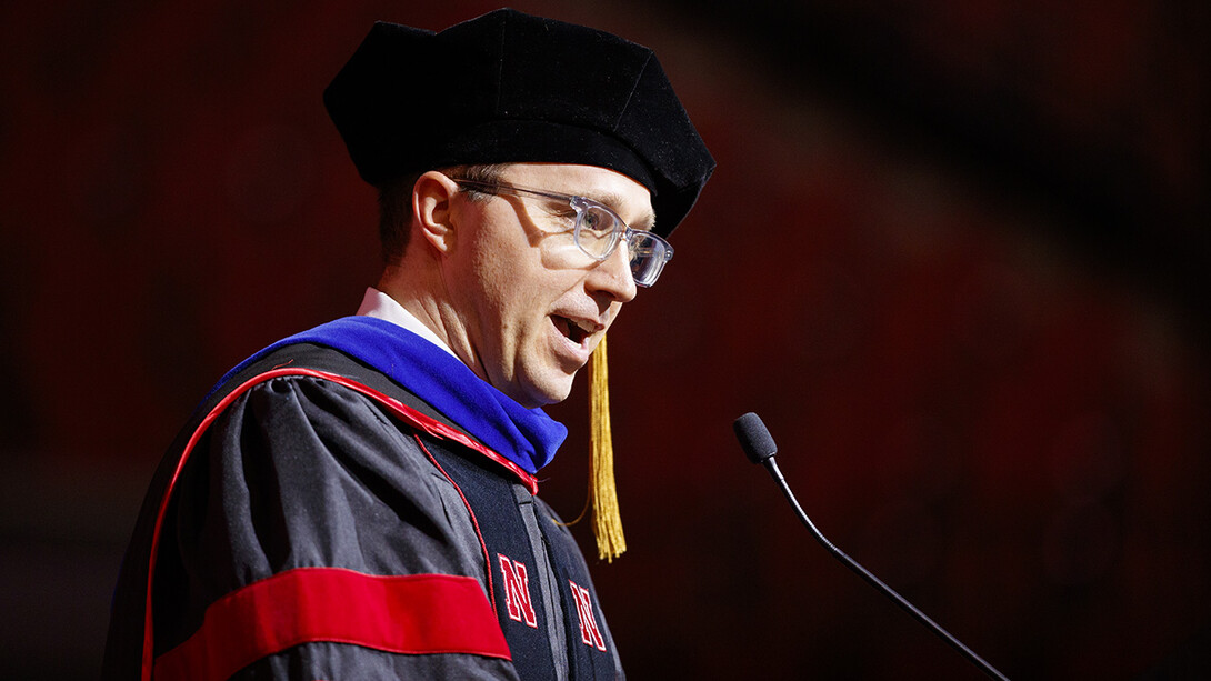 L.J. McElravy gives the commencement address at the graduate and professional degree ceremony Dec. 20 at Pinnacle Bank Arena. 