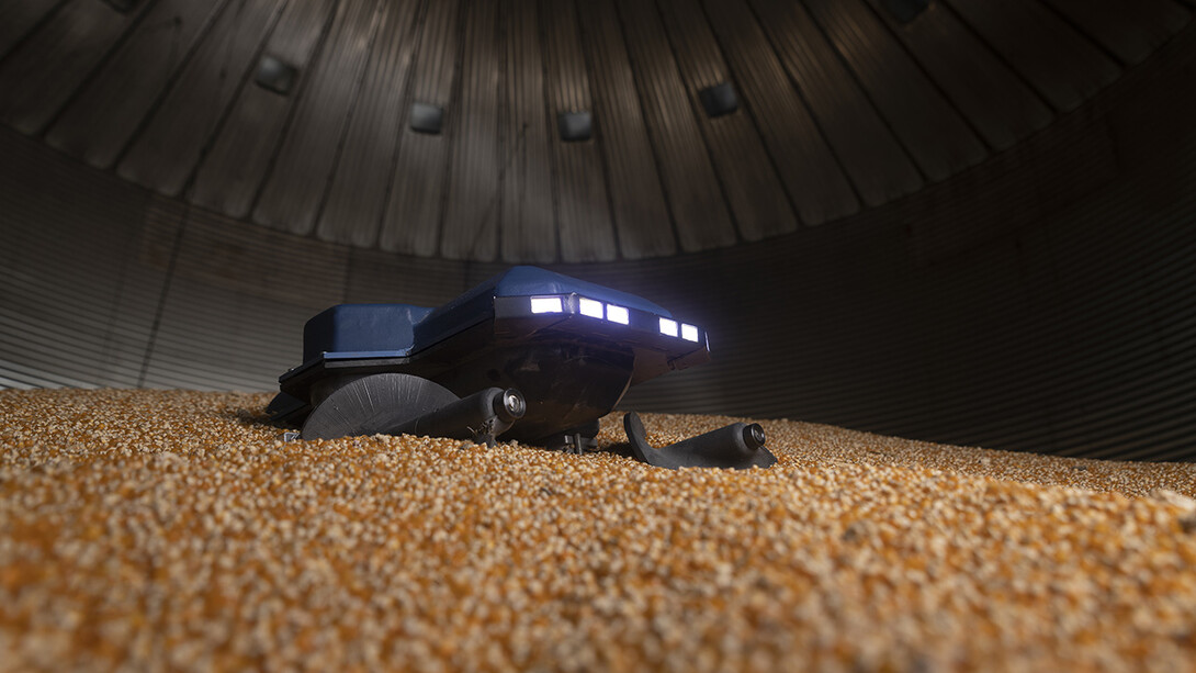 The Grain Weevil is a 30-pound remote-controlled robot that uses augers and gravity to level grain and redistribute it throughout the bin. It is portable, waterproof and dustproof. If it is accidentally buried, it can dig itself out of up to 5 feet of grain.