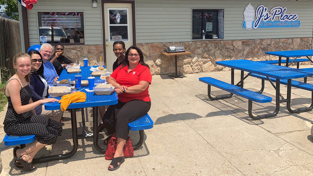 Helen Fagan, Rural Fellows coordinator, meets with student fellows Brianna Gable, Benjamin Niyodusenga and Lillian Uwanjye; Susan Norris, director of Pierce County Economic Development; and Wanda Backus, owner of J’s Place.