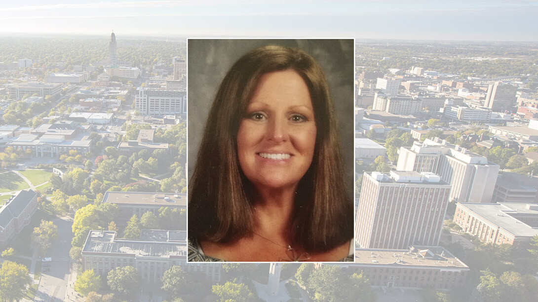 Color portrait of Mary Trehearn on campus background